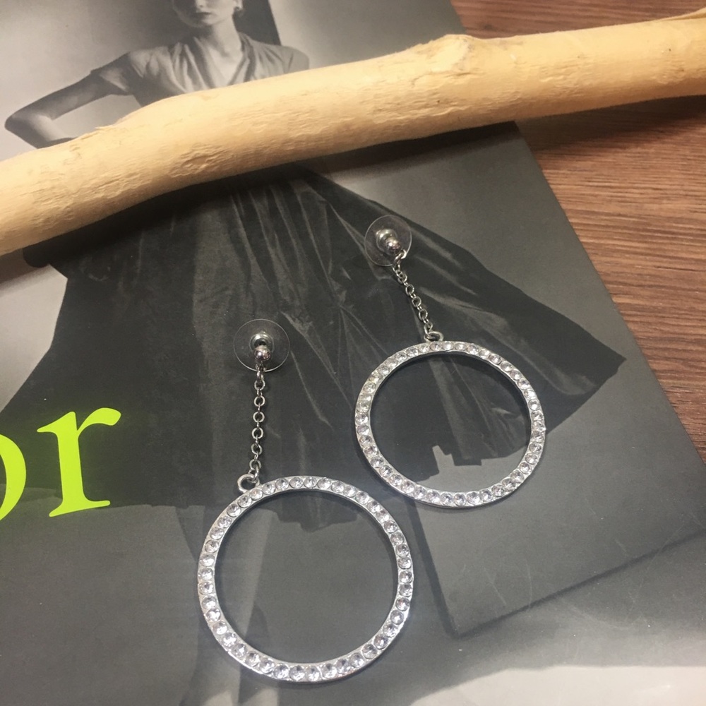 Sterling silver beaded circle drop earrings.